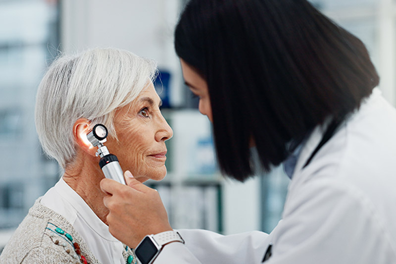 woman getting hearing exam